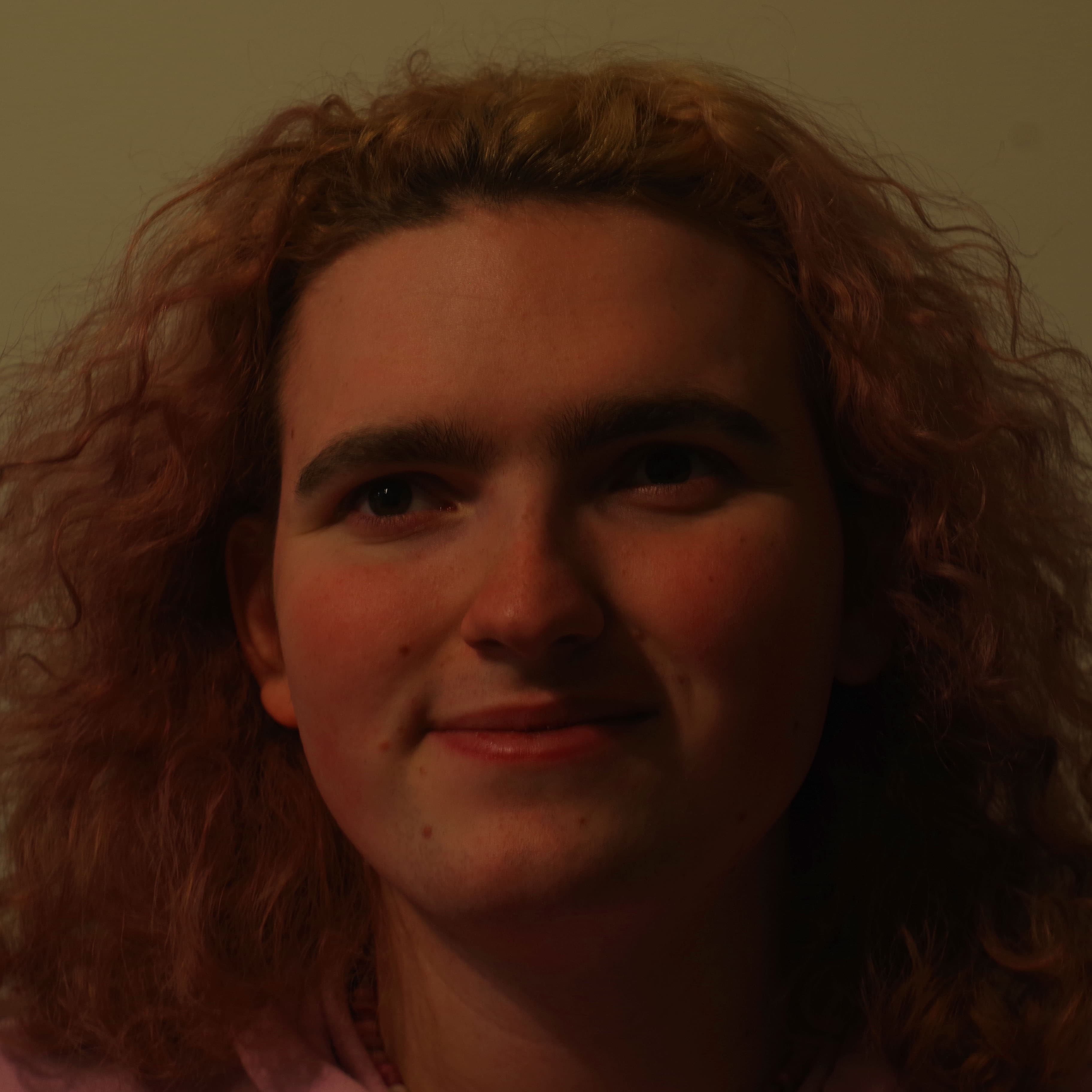 a close-up portrait of me looking slightly away from the camera