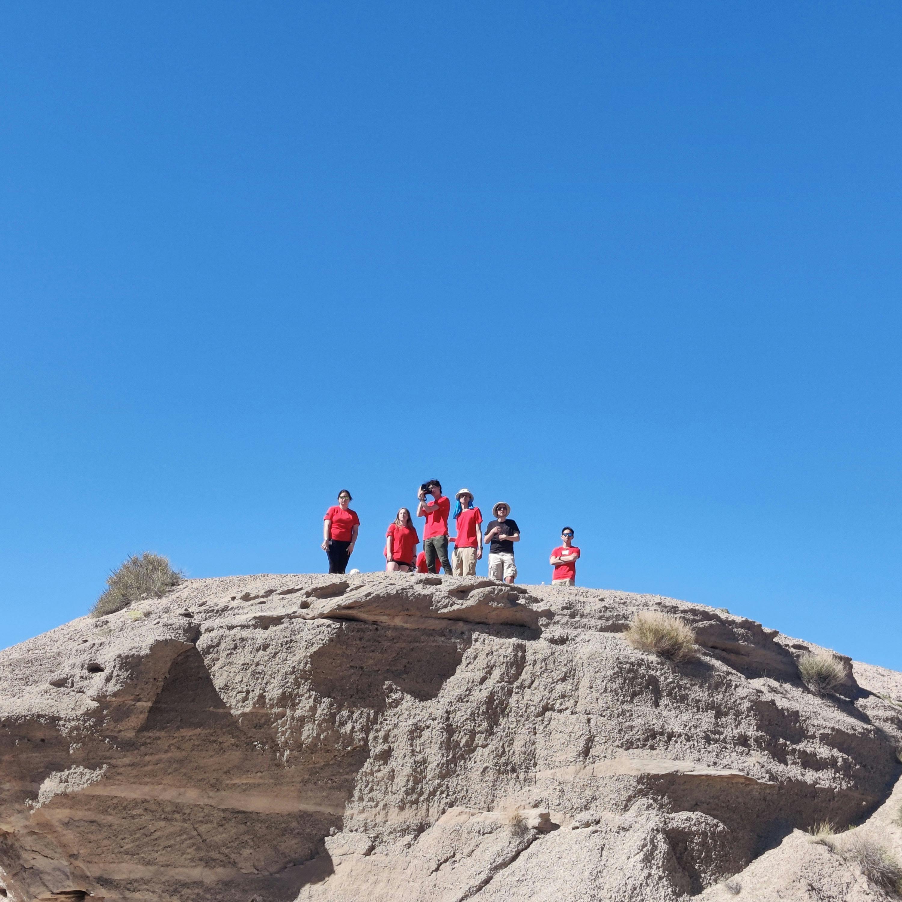 (most of) our team, standing on a rock