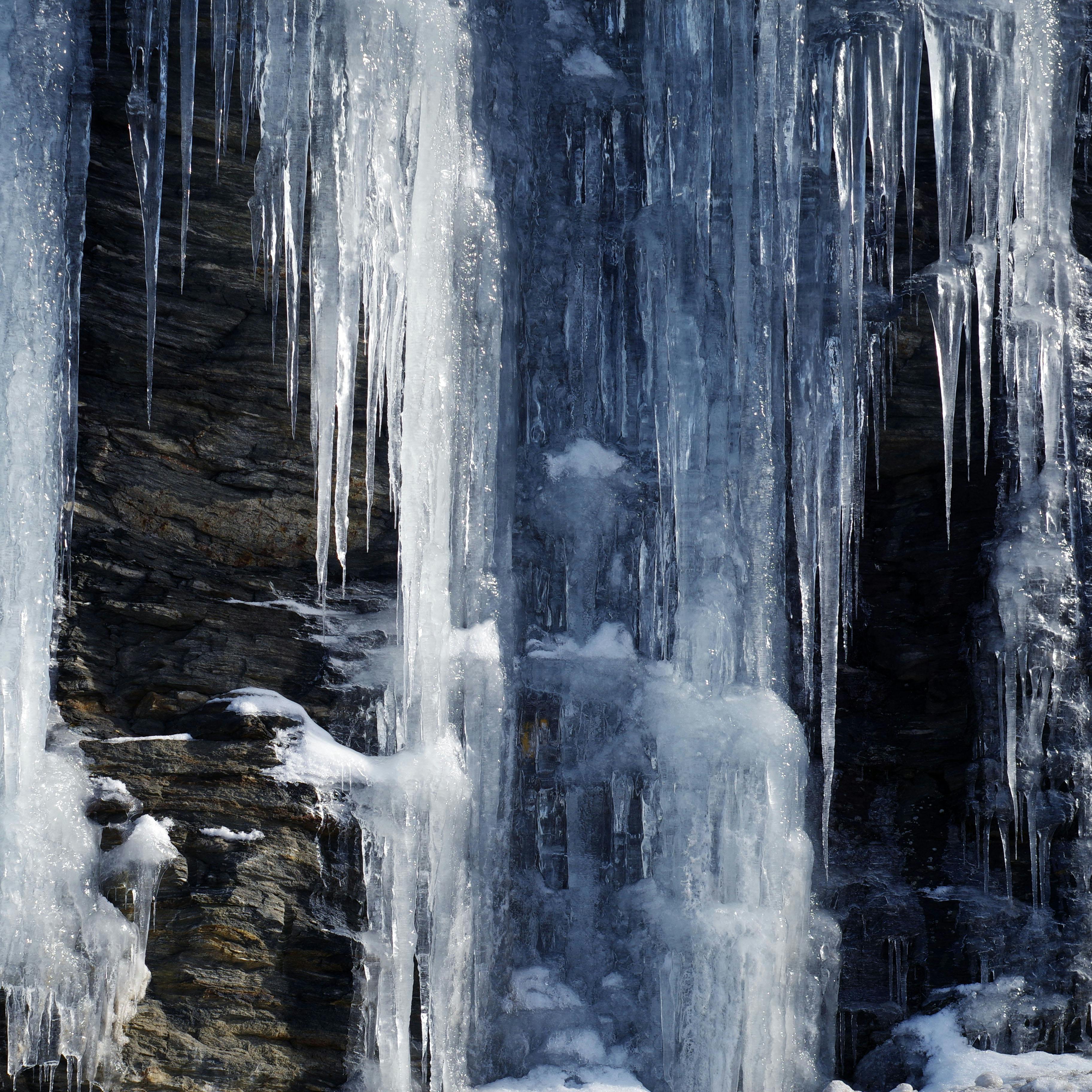 large icicles covering the face of a cliff