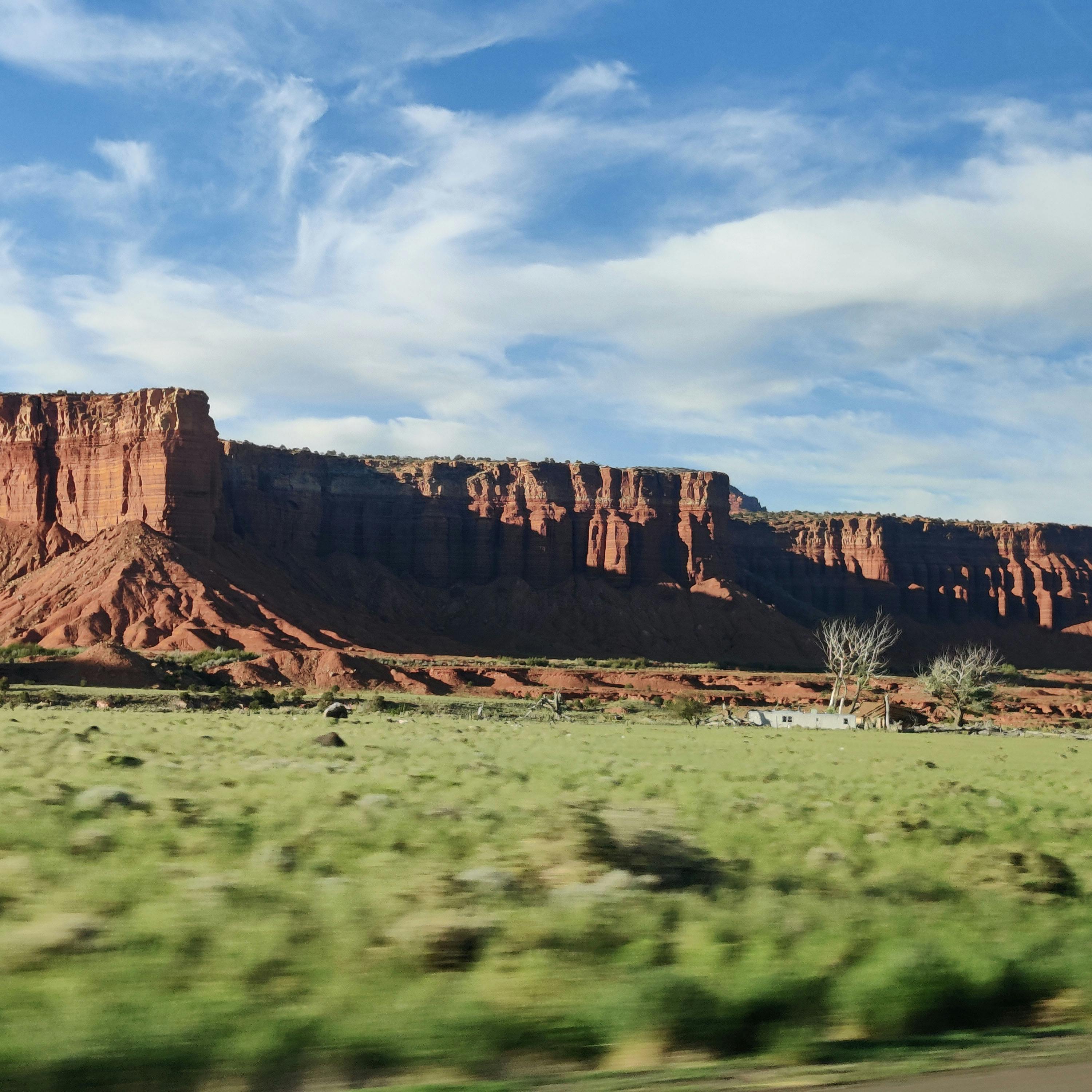 a mesa near capitol reef with a blurred background in the front