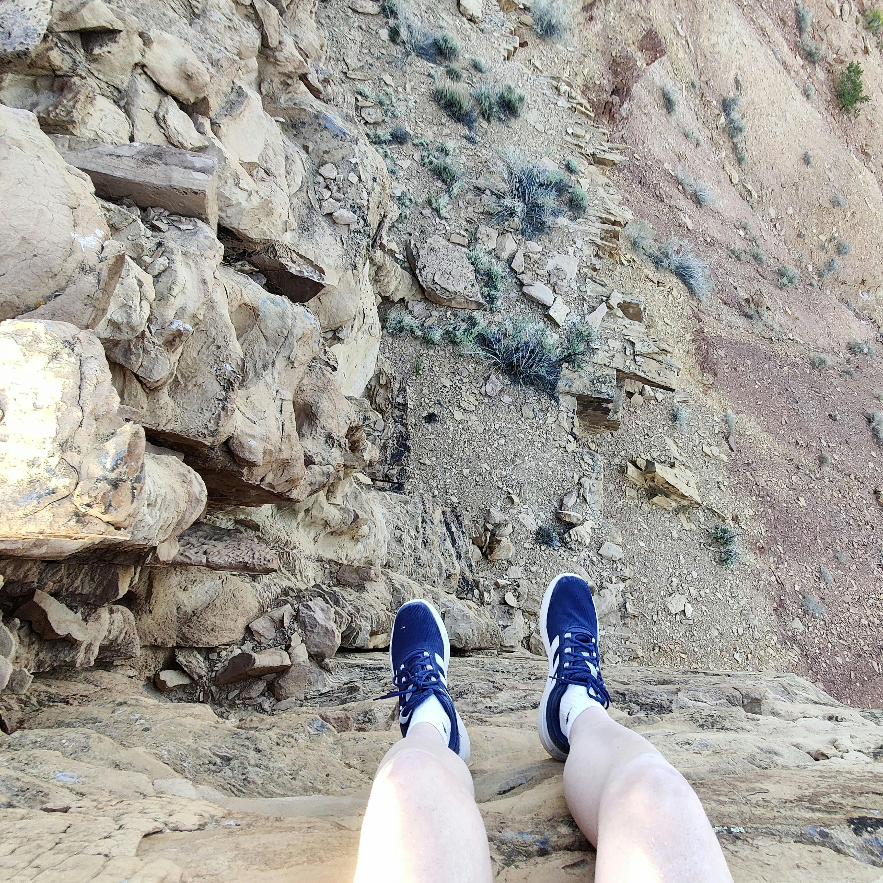 looking down past my feet off of a small cliff